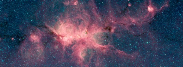 The Cat's Paw Nebula, imaged here by NASA's Spitzer Space Telescope using the IRAC instrument, is a star-forming region inside the Milky Way Galaxy. The dark filament running through the middle of the nebula is a particularly dense region of gas and dust. Image Credit: NASA/JPL-Caltech The Cat's Paw Nebula, imaged here by NASA's Spitzer Space Telescope using the IRAC instrument, is a star-forming region inside the Milky Way Galaxy. The dark filament running through the middle of the nebula is a particularly dense region of gas and dust. Image Credit: NASA/JPL-Caltech