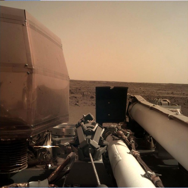 The Instrument Deployment Camera (IDC), located on the robotic arm of NASA's InSight lander, took this picture of the Martian surface on Nov. 26, 2018, the same day the spacecraft touched down on the Red Planet. The camera's transparent dust cover is still on in this image, to prevent particulates kicked up during landing from settling on the camera's lens. This image was relayed from InSight to Earth via NASA's Odyssey spacecraft, currently orbiting Mars. Credit: NASA/JPL-Caltech The Instrument Deployment Camera (IDC), located on the robotic arm of NASA's InSight lander, took this picture of the Martian surface on Nov. 26, 2018, the same day the spacecraft touched down on the Red Planet. The camera's transparent dust cover is still on in this image, to prevent particulates kicked up during landing from settling on the camera's lens. This image was relayed from InSight to Earth via NASA's Odyssey spacecraft, currently orbiting Mars. Credit: NASA/JPL-Caltech